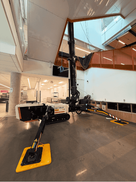 Crawler-mounted aerial work platform in interior staircase of office building photo 10 by SOSEQUIPMENT