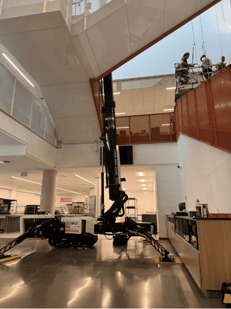 Crawler-mounted aerial work platform in interior staircase of office building photo 3 by SOSEQUIPMENT