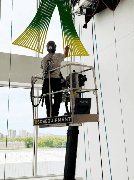 Crawler-mounted aerial work platform in interior staircase of office building photo 7 by SOSEQUIPMENT