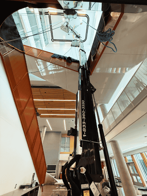 Crawler-mounted aerial work platform in interior staircase of office building photo 8 by SOSEQUIPMENT