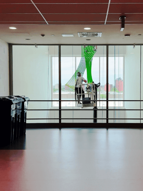 Crawler-mounted aerial work platform in interior staircase of office building photo 9 by SOSEQUIPMENT